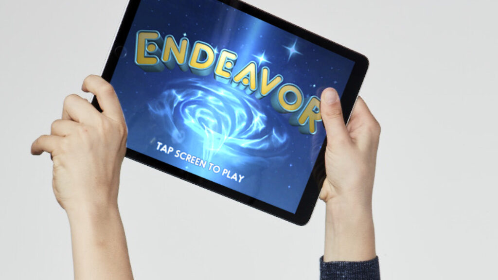 Boy holding up Endeavor RX on iPad